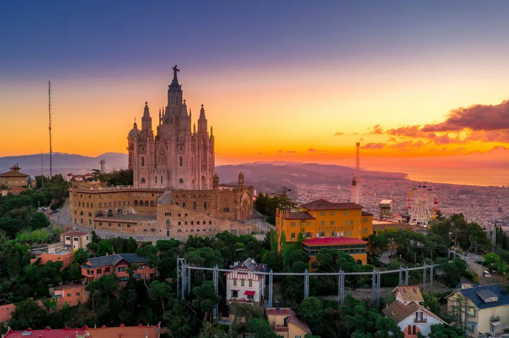 Sagrat Cor church on Tibidabo hill above Barcelona at sunset